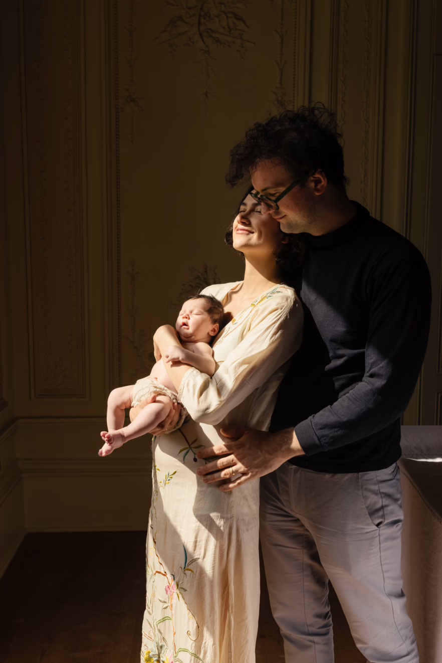 Family portrait with a newborn baby at home